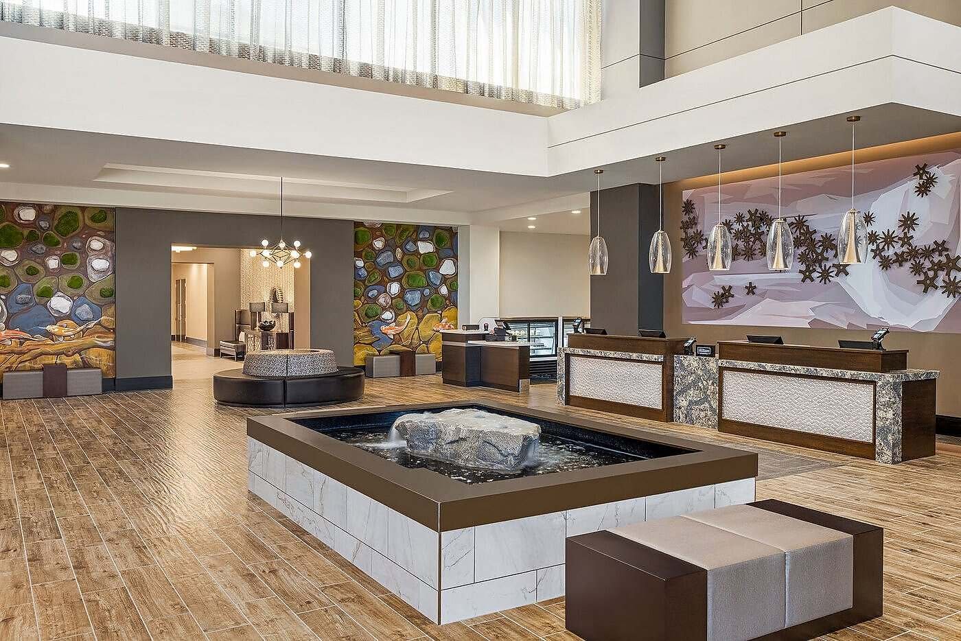 Rock-Overflowing-with-water-with-reflection-pool-at-EMbassy-Suites-Round-Rock-Texas-2