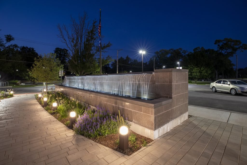 Outdoor fountain reflection pool with overflowing weirs free falling water for prospect heights public library 6