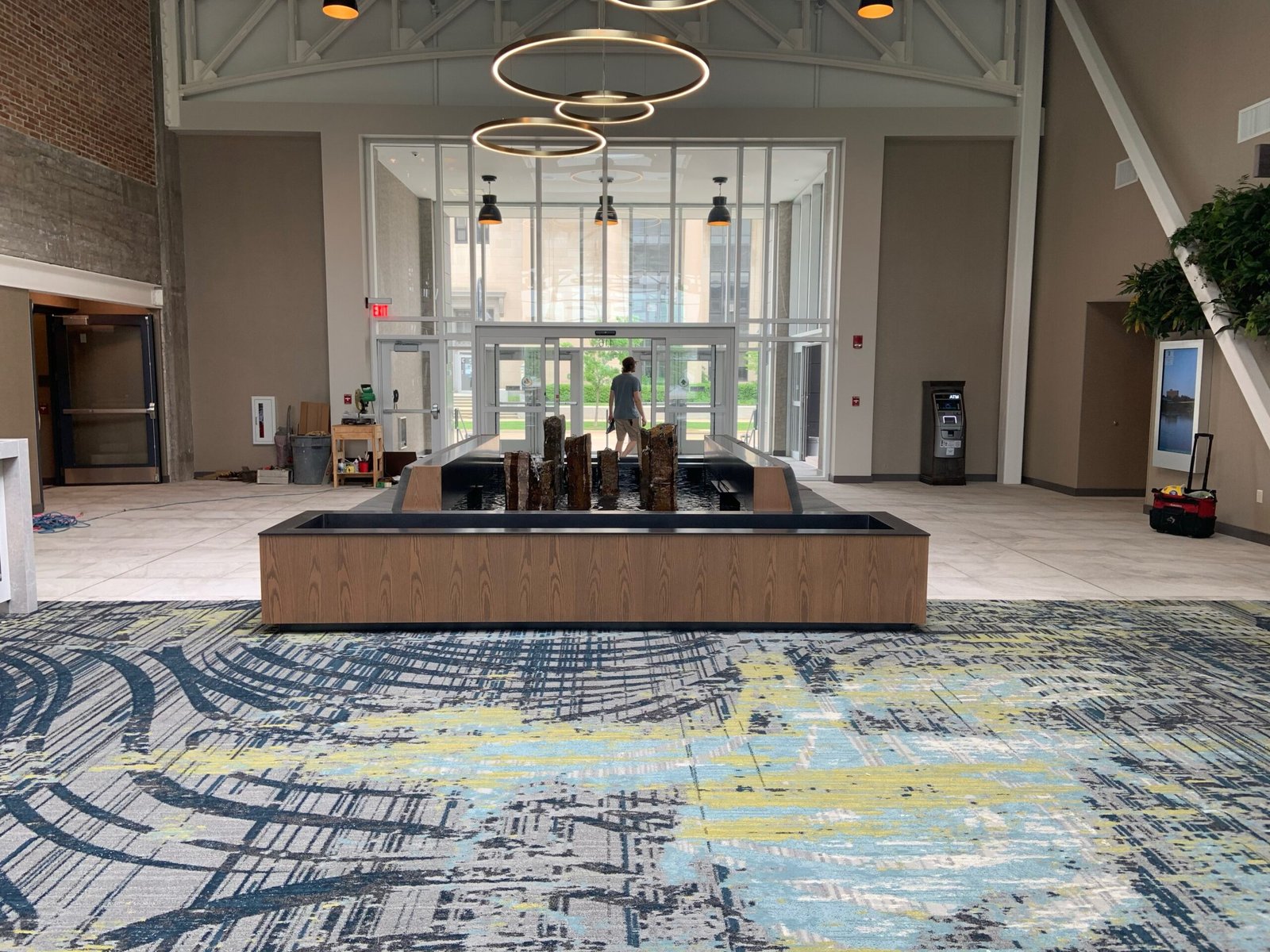 Reflection pool with stone sculptures overflowing at embassy suites by hilton rockford illinois 1 scaled