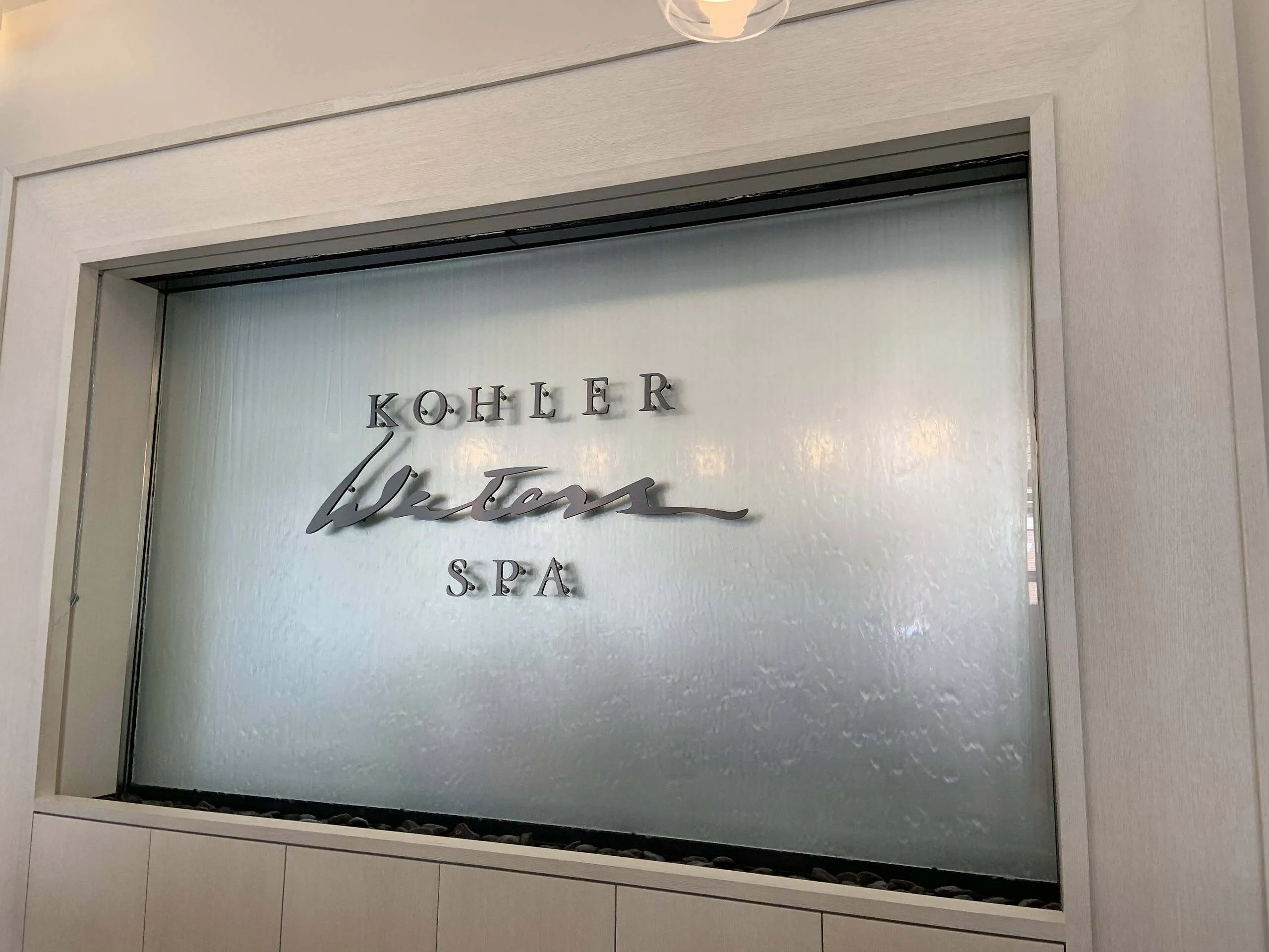 Glass water wall frameless at kohler waters spa in chicago illinois