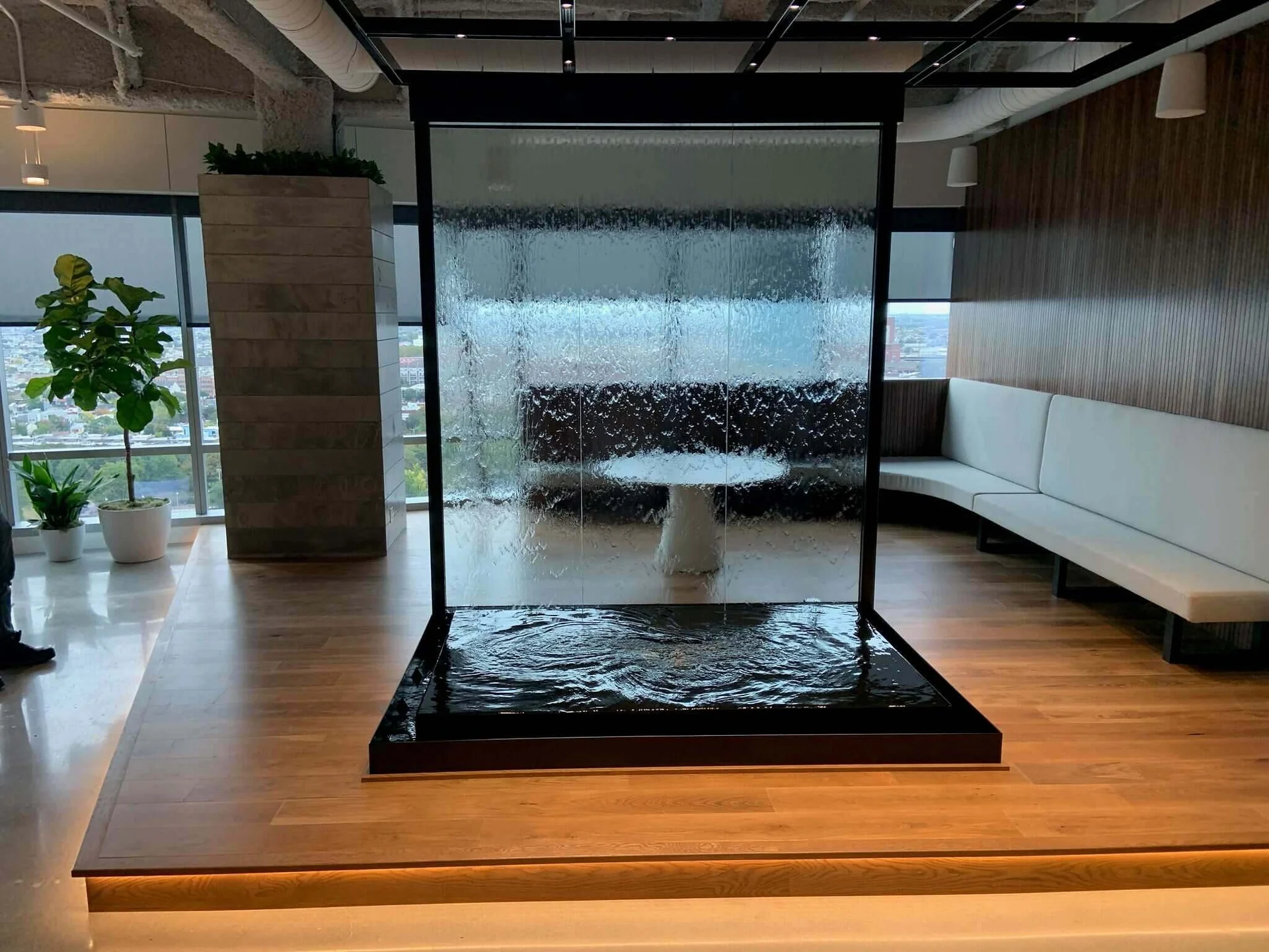 Glass water wall with reflection pool and black powder coated frame in philadelphia scaled 1
