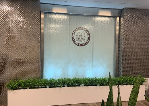 Glass water wall with stainless frame at family christian health centers indiana 1